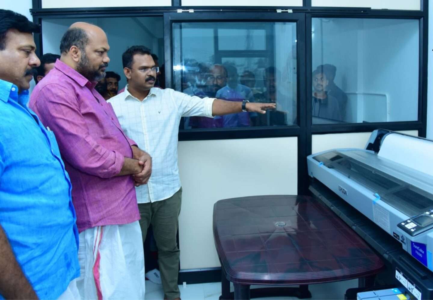 MLA M Noushad and industrial Minister P Rajeev visit the Aidan global sportswear manufacturing unit at Kollam.