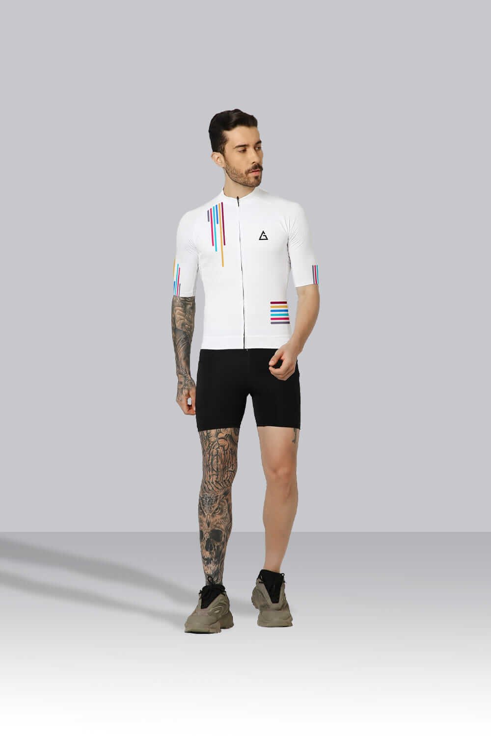 Cyclist wearing the Ultra Randonneurs Race-Fit Cycling Jersey with YKK zipper, silicone hem, and three rear pockets.