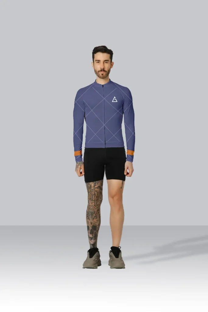 Cyclist wearing the Rhino Aero Cycling Jersey Race Fit in dark blue with an orange stripe, designed for premium performance and comfort.