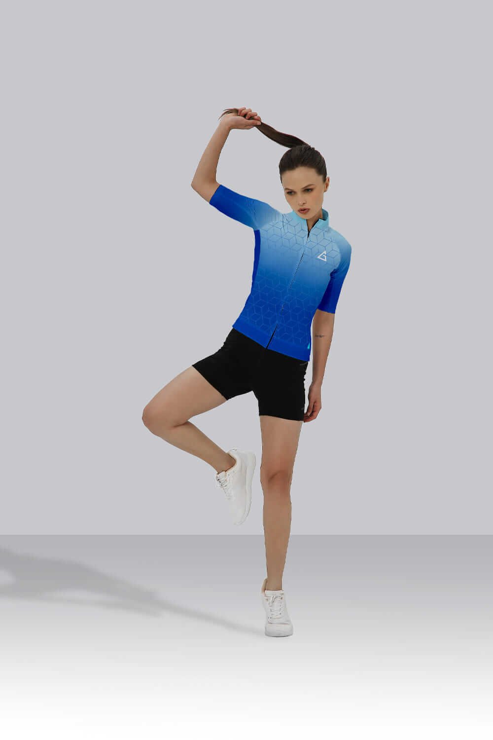 Cyclist wearing Blue Hexa Cycling Jersey with race-fit design, hexagonal pattern, and premium breathable fabric.