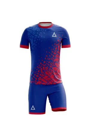 Front view of fully sublimated football kit with blue and red shattered graphic pattern, red sleeve cuffs and collar, sublimated football jersey design, lightweight and moisture wicking.