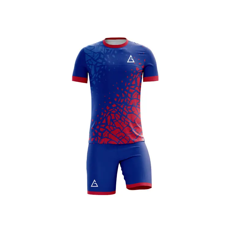 Front view of fully sublimated football kit with blue and red shattered graphic pattern, red sleeve cuffs and collar, sublimated football jersey design, lightweight and moisture wicking.